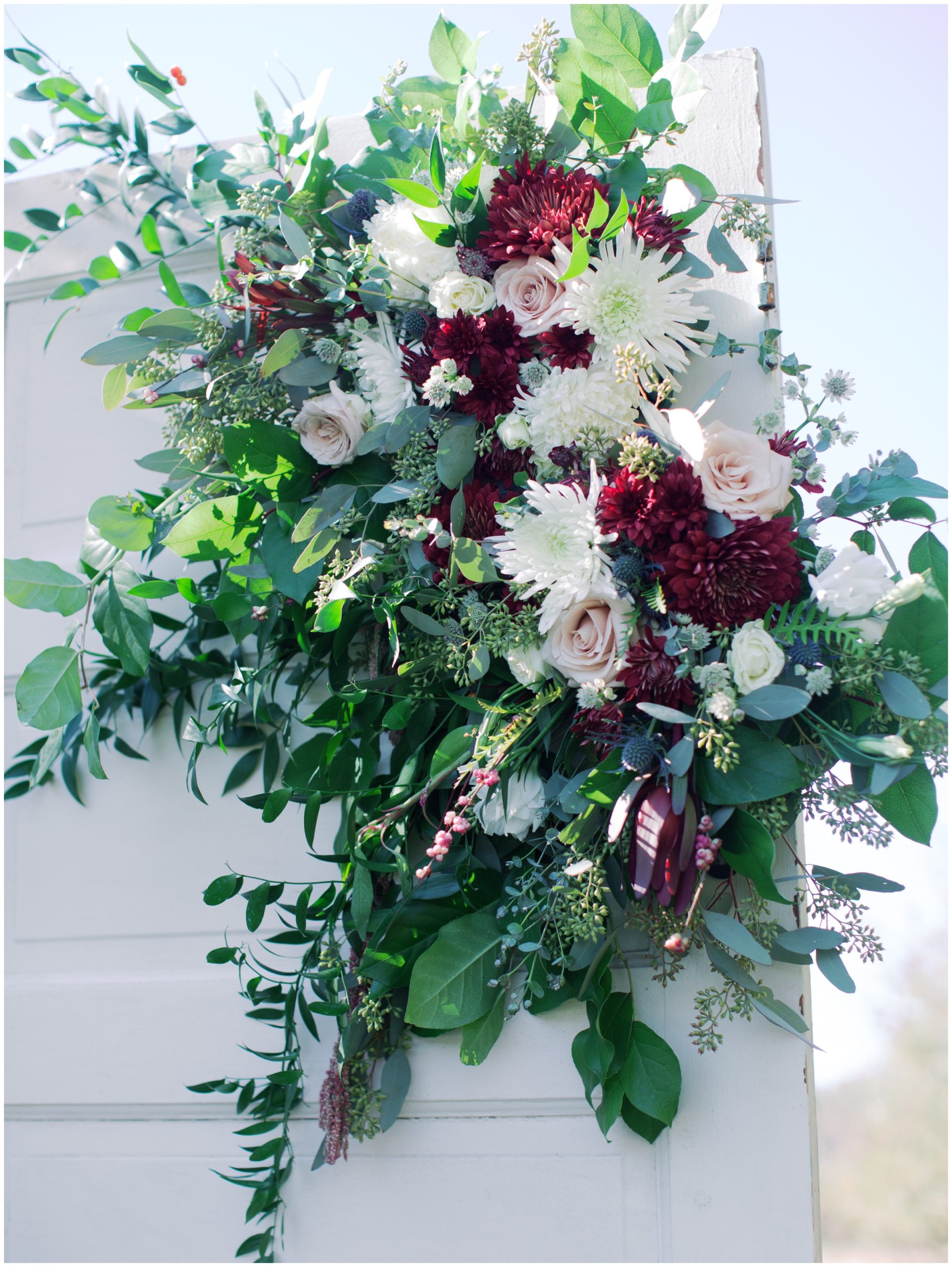 Vintage Door Ceremony Backdrop, Burgundy and white ceremony flowers, Jennifer Clapp Photography